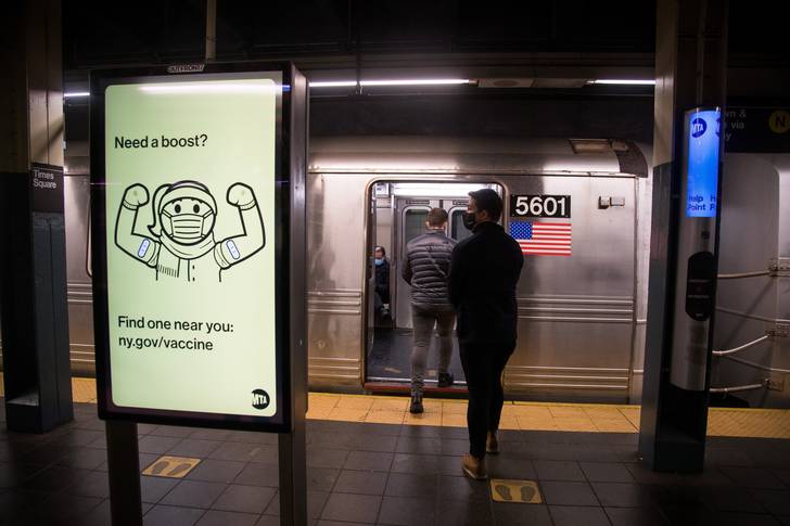 A COVID-19 vaccine booster advertisement is displayed in the New York City subway, January 9th, 2022.